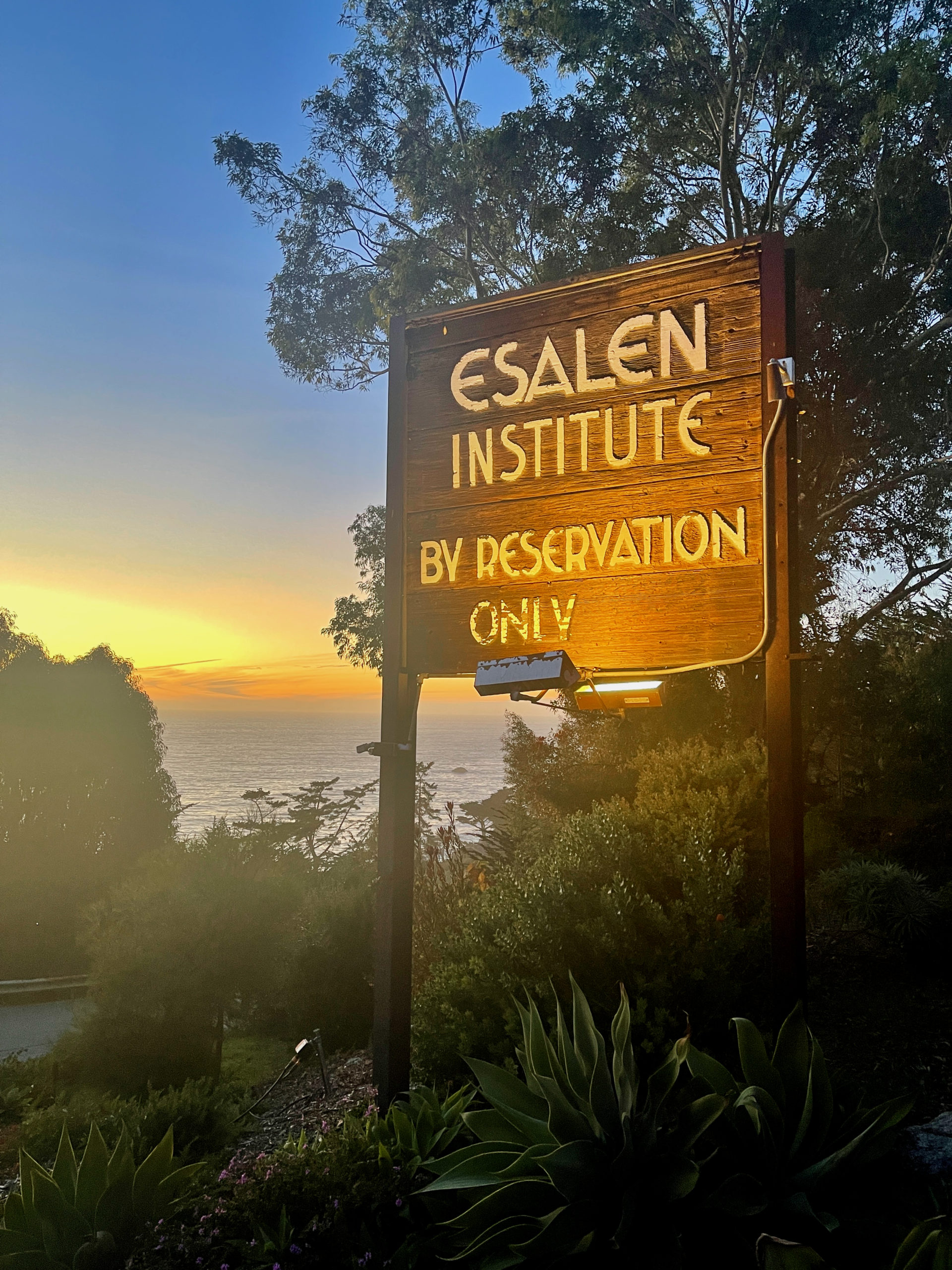 Esalen Institute sign with sunset in background